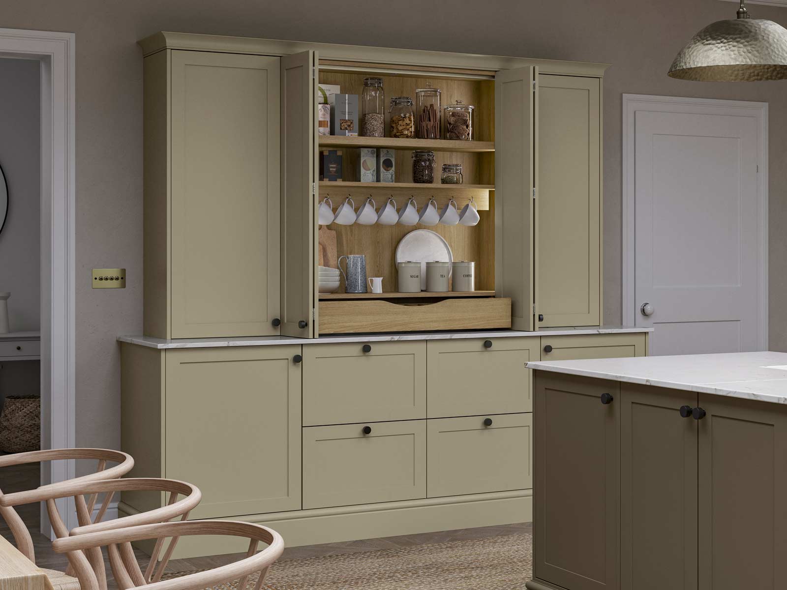 A tea and coffee station cum breakfast cupboard in a light wood finish