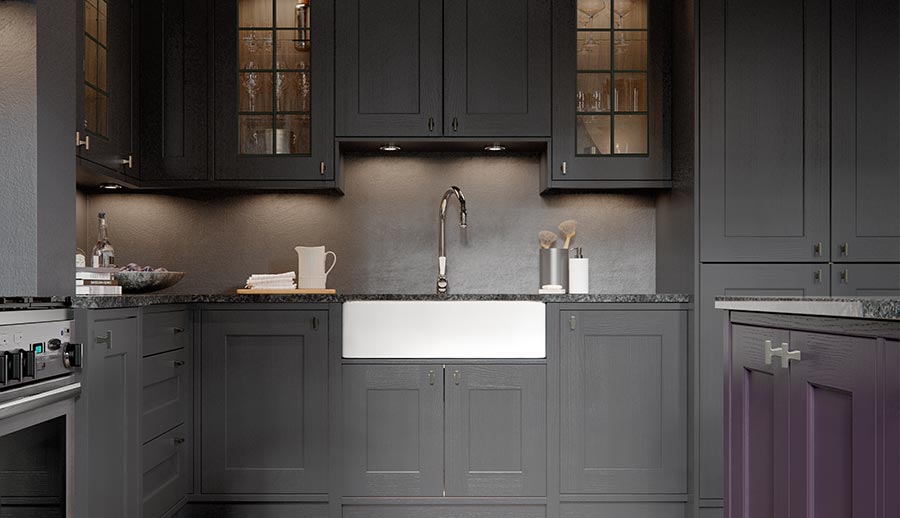 Beautiful dark shaker kitchen featuring glass cabinetry