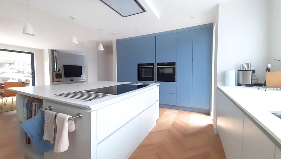 Two tone handleless kitchen with blue and white