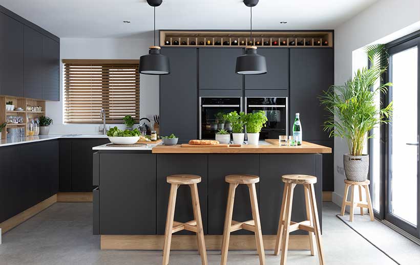 Modern dark kitchen with wood features and kitchen island