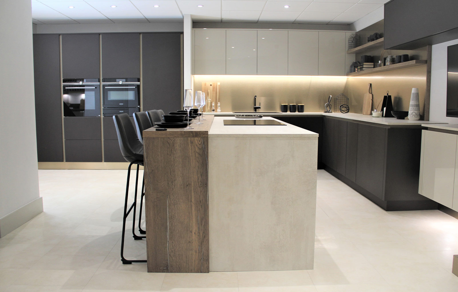 Modern luxury kitchen with dark kitchen cabinets and metalic accents