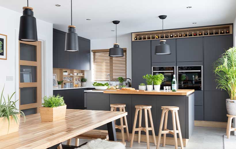 Modern scandi kitchen featuring dark kitchen doors and kitchen island