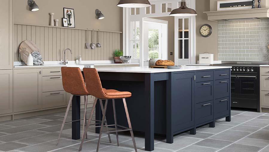 A warm grey shaker kitchen with blue kitchen island
