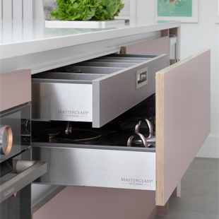 A handleless kitchen drawer with stainless steel drawer box