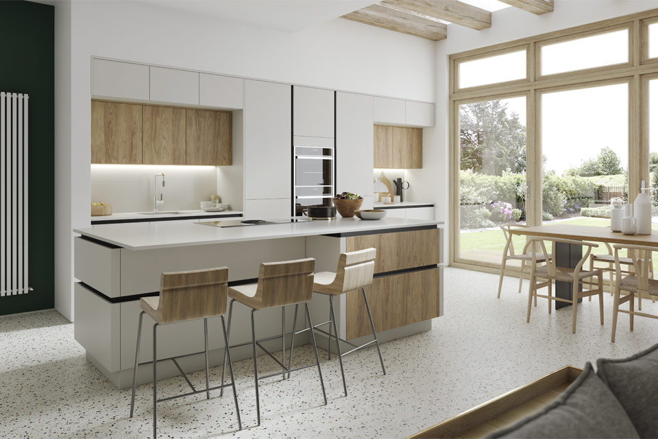 A grey handleless kitchen with wood-effect doors