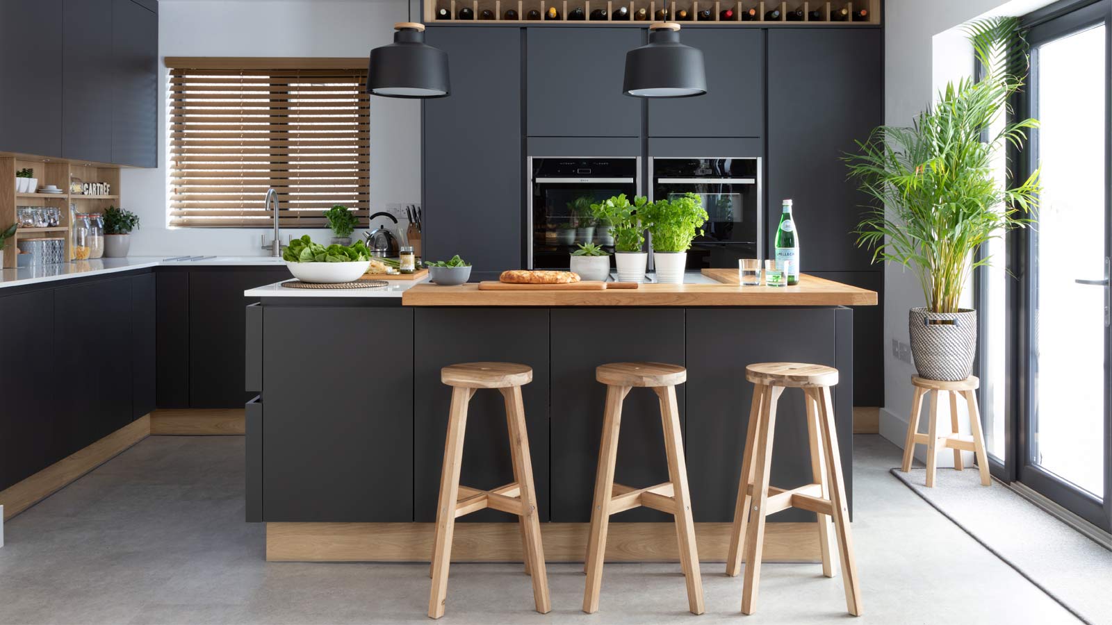Biophilic interior design demonstrated in a handleless, modern kitchen