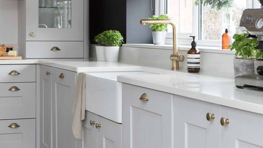 Beautiful classic shaker kitchen featuring gold handles