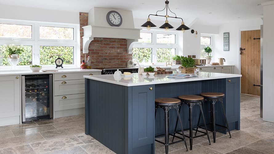 A classic shaker kitchen featuring blue kitchen island