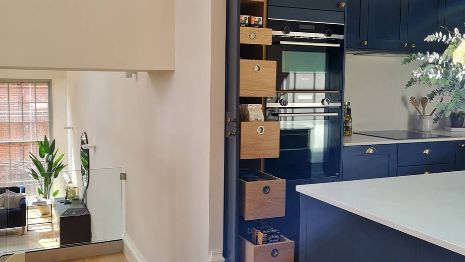Larder cabinet in a blue shaker kitchen
