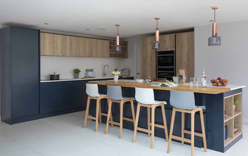 A beautiful modern blue kitchen with oak