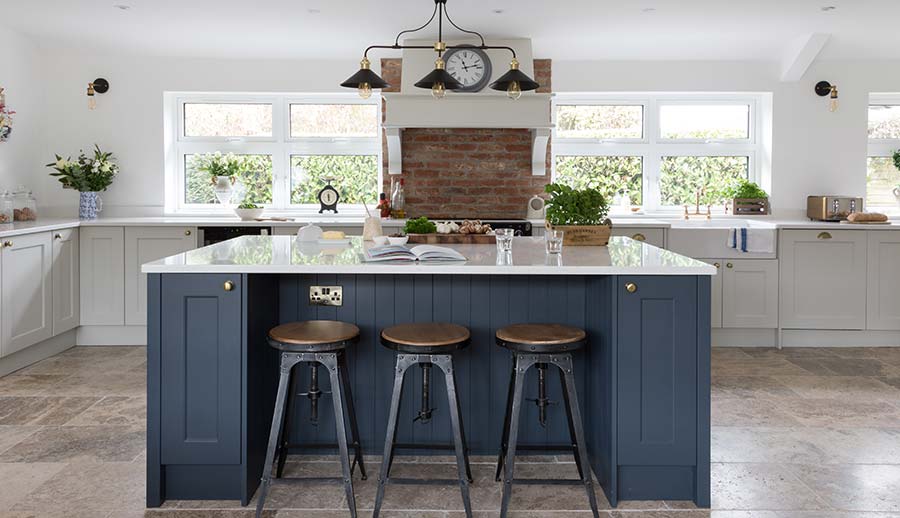 Blue kitchen island in a classic kitchen