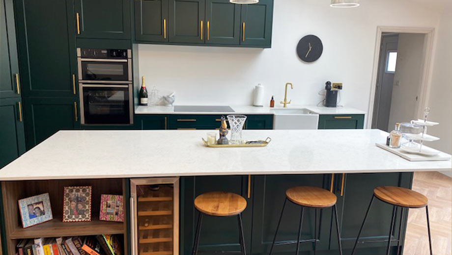 Classic green kitchen with gold handles