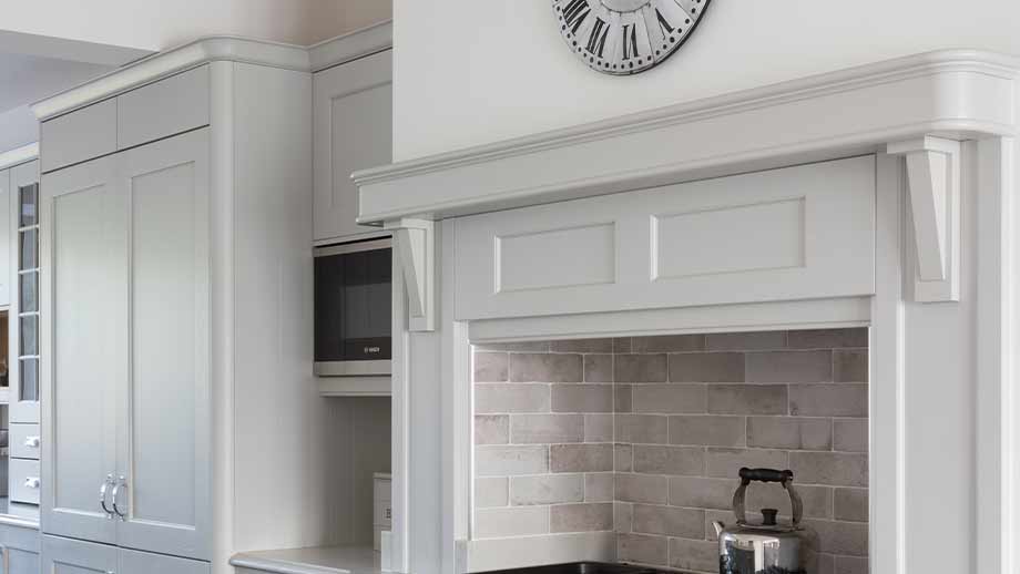 A statement mantle in a classic kitchen