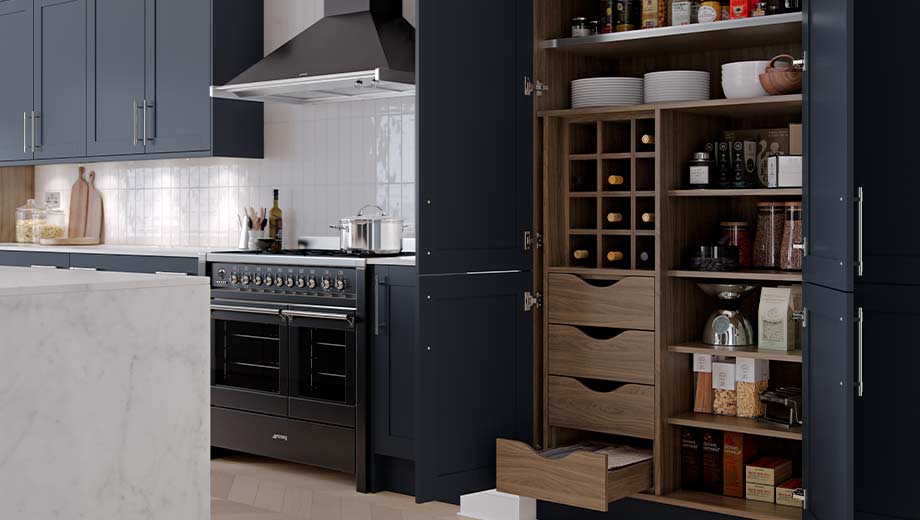 Navy kitchen featuring pantry storage feature