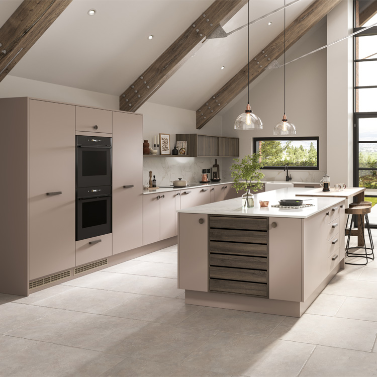 A dusty pink kitchen with vintage pink kitchen cupboards