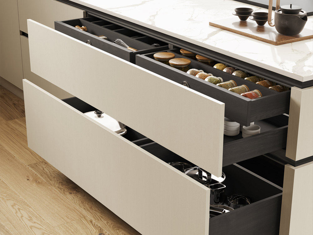 Wide greige handleless kitchen drawers with internal spice drawers