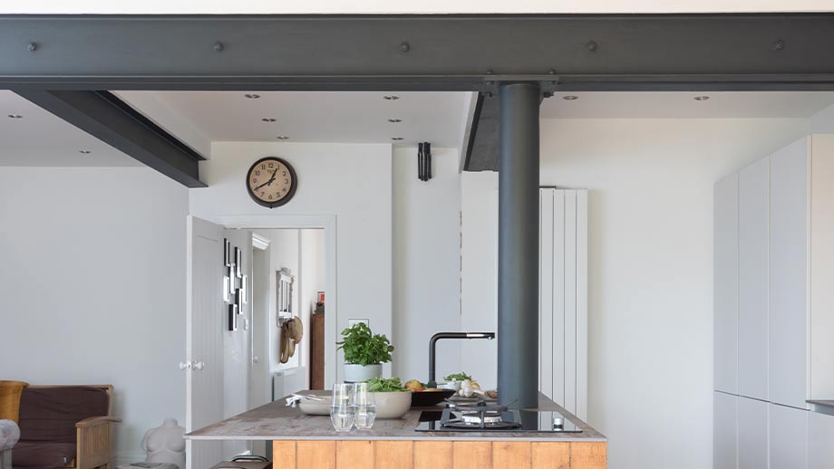 Exposed beams in an industrial kitchen design