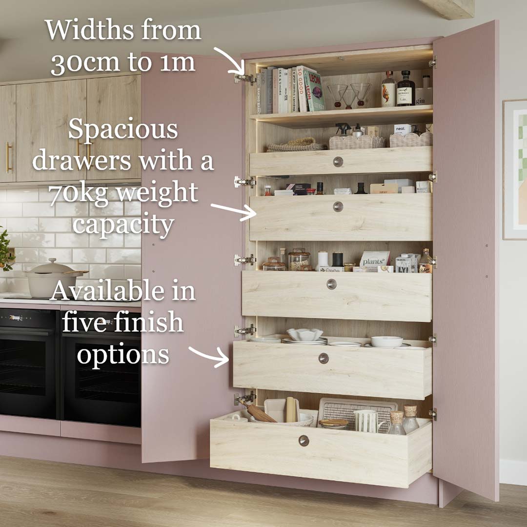Pull-out larder unit with drawers in a pink kitchen