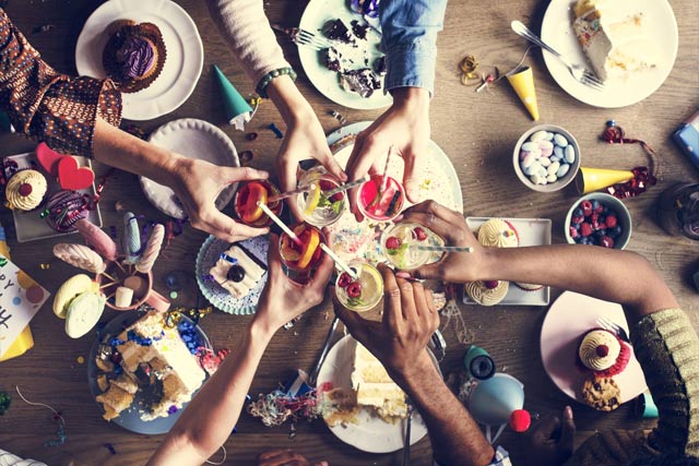 Bar dresser kitchen party group drinks toast over a table