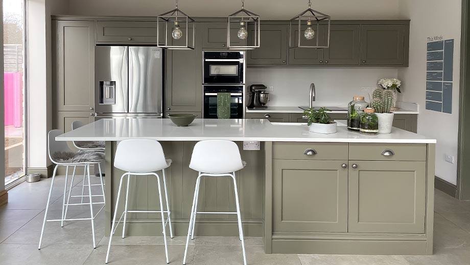 Olive green kitchen with large kitchen island