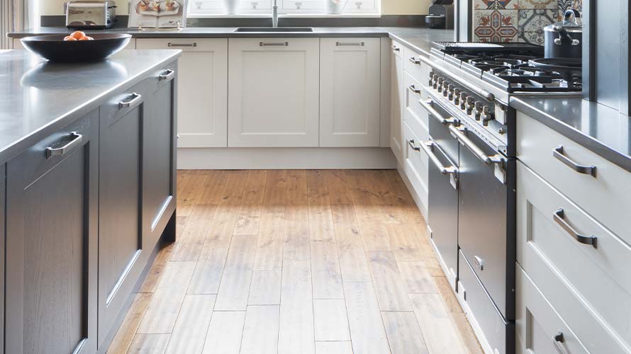 Example of a working triangle in a grey and white Shaker kitchen