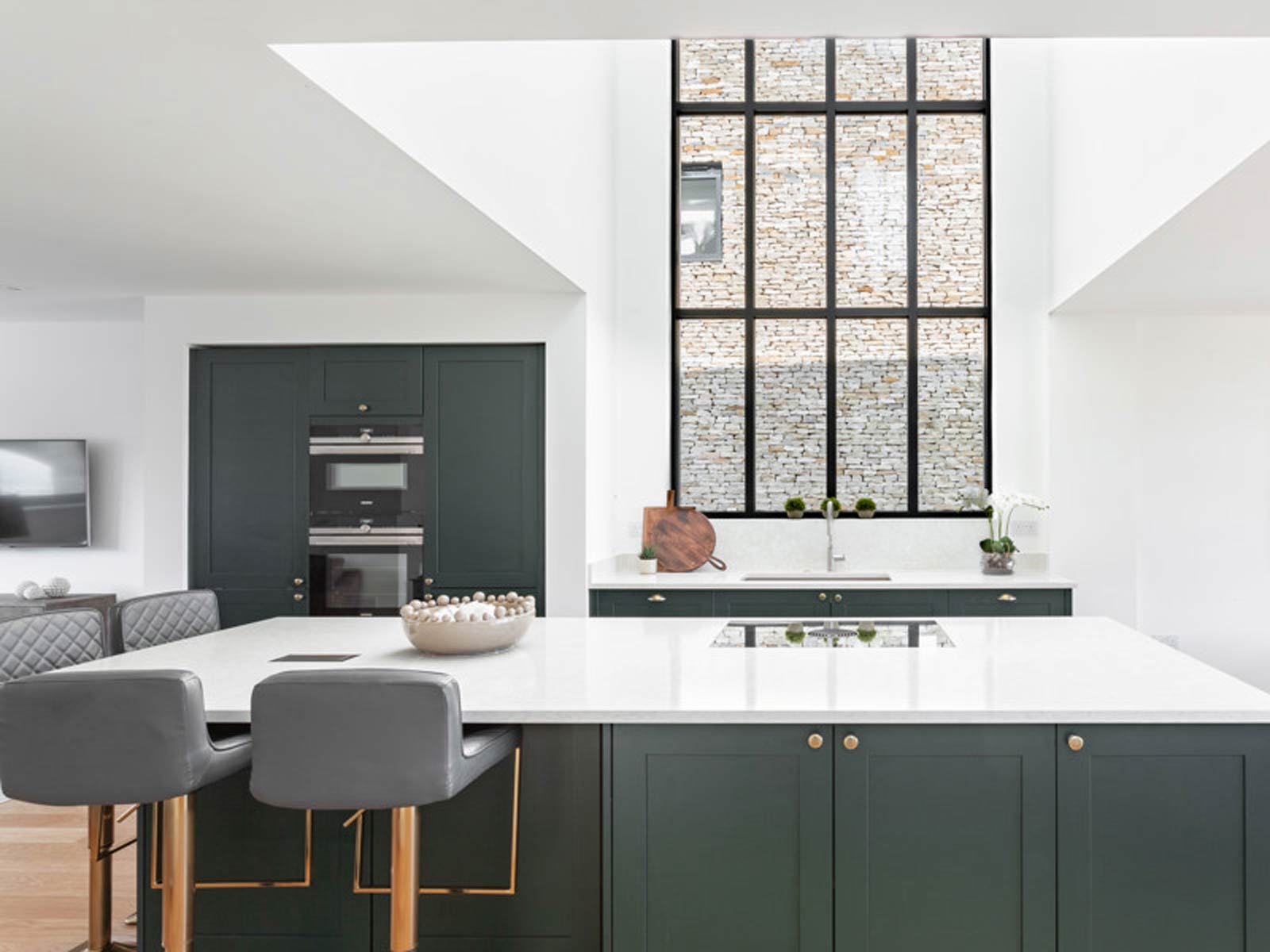 The perfect kitchen with dark green cabinets and a kitchen island