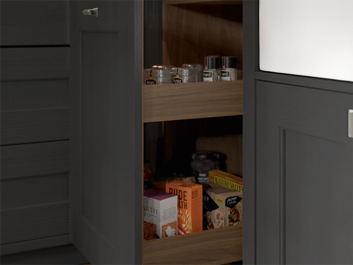 A pull-out cabinet kitchen furniture item containing spices and food packs