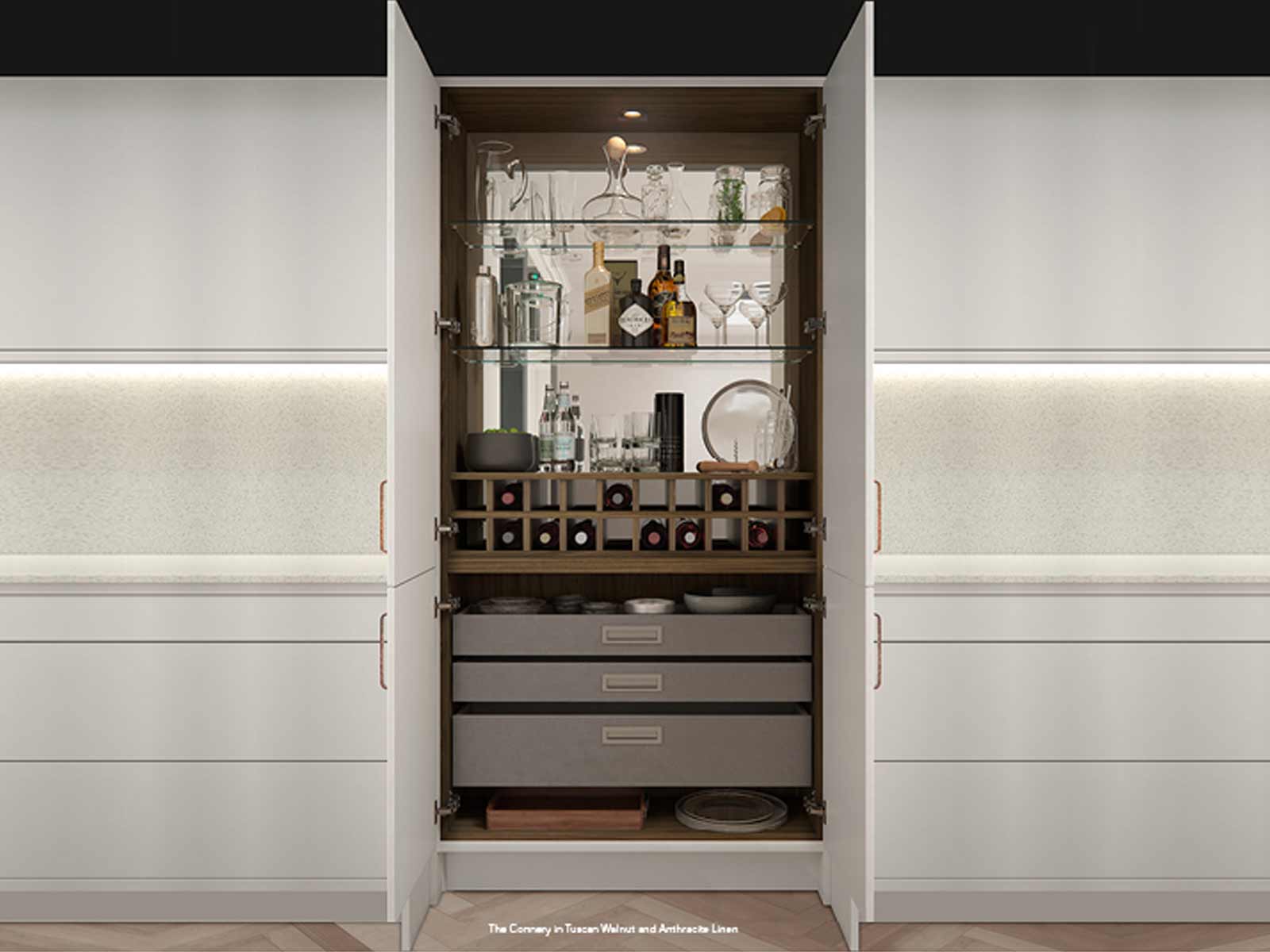 A Tuscan walnut drinks cabinet with grey fabric drawers in a H Line kitchen