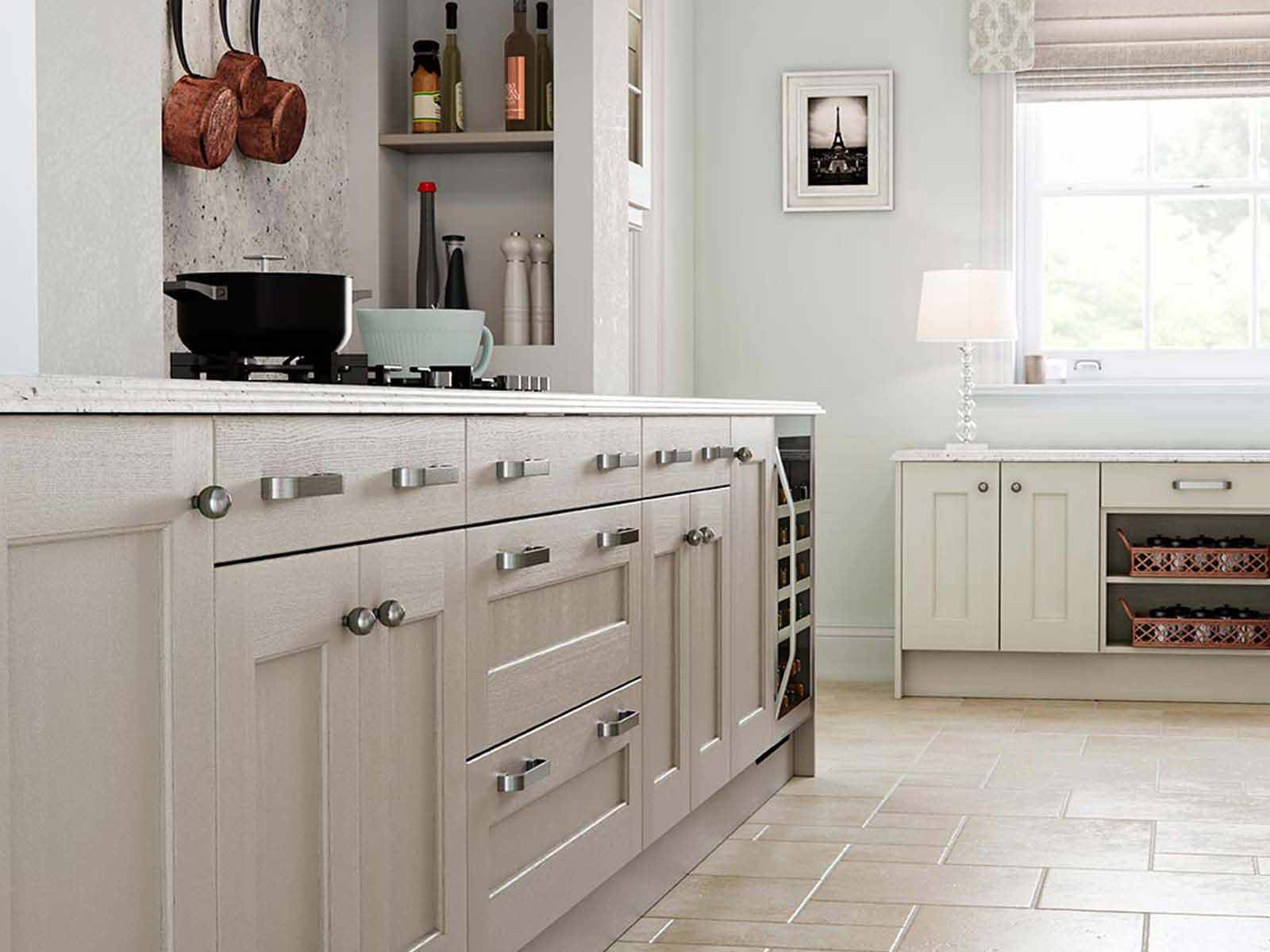 Ash wood Ashbourne kitchen cabinets with marble worktop