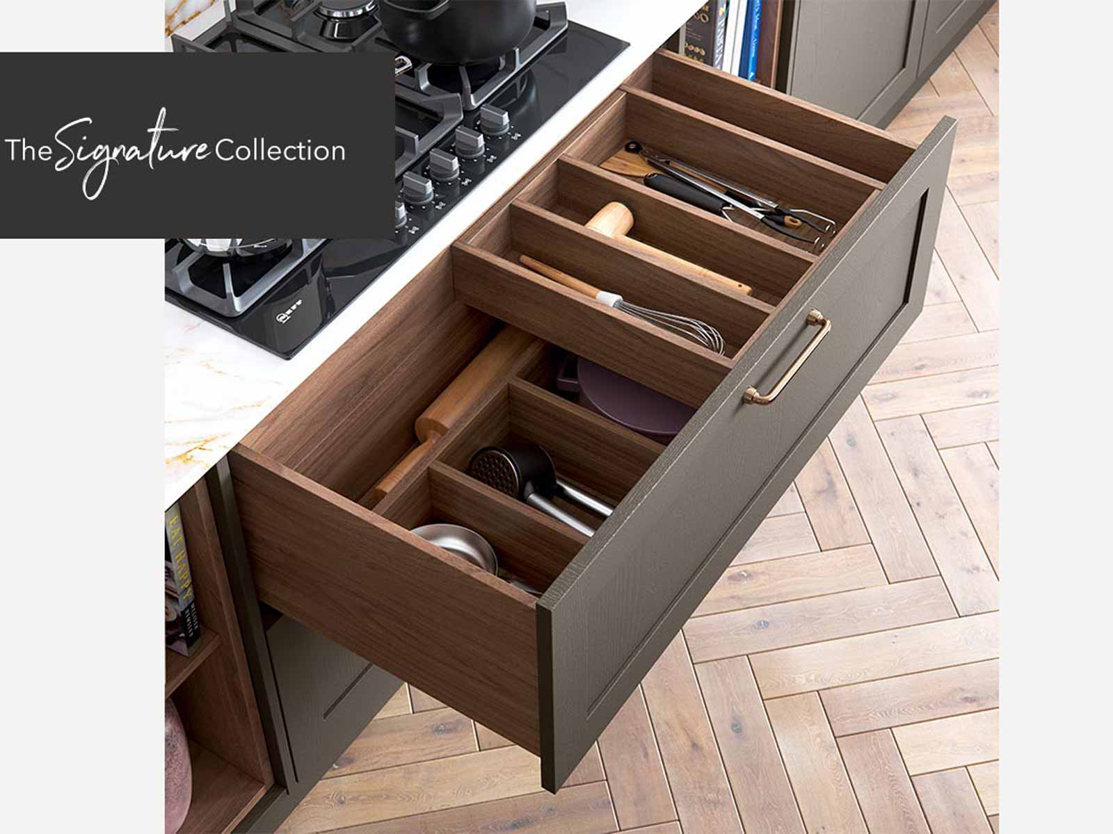 Open full-wood kitchen drawer under hobs