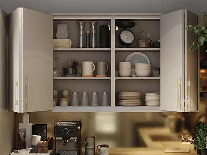 Space saving doors fitted to a flat slab modern kitchen range