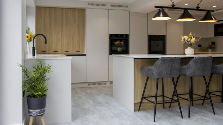 A white and wood kitchen with brown wood kitchen doors