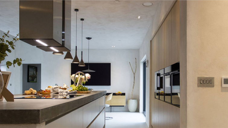 A kitchen island used as a mid-century modern dining table