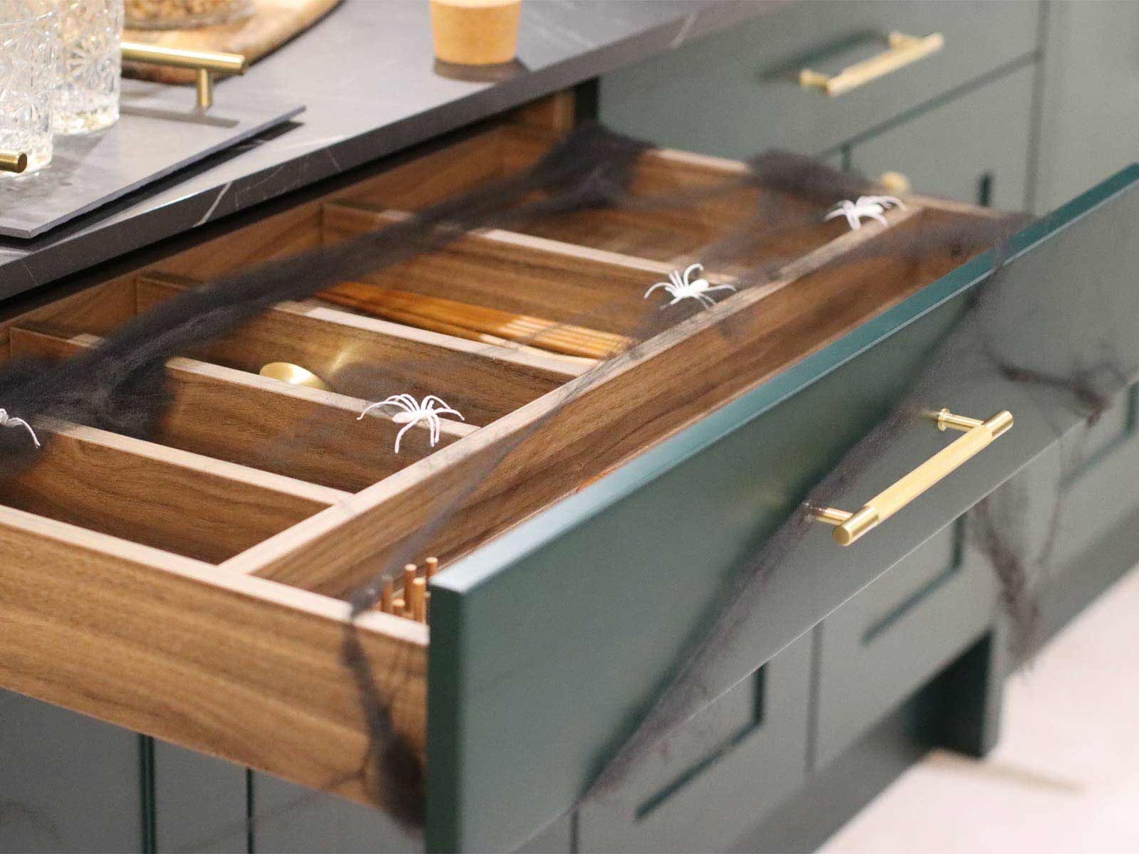 Wood-effect kitchen cabinet drawers decorated for Halloween