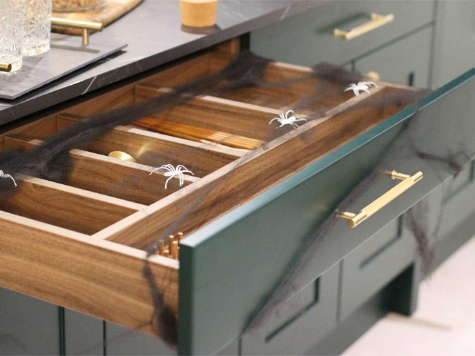 Wood-effect kitchen cabinet drawers decorated for Halloween