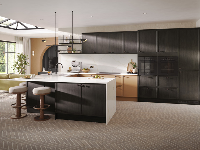 Dark oak kitchen cabinets and matching decorative shelf in an orange kitchen