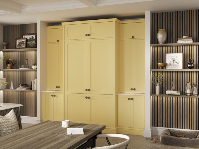 A kitchen shelving and pantry wall with matching wood stain cohesion