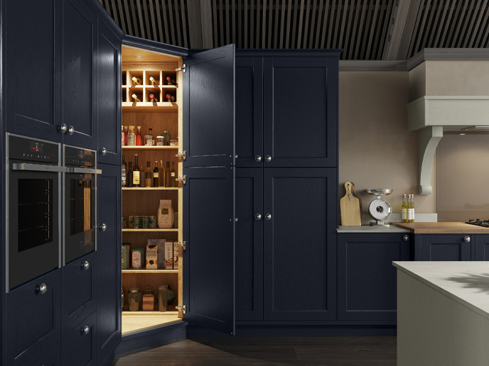 A classic corner pantry with coordinated oak internals and oak worktops