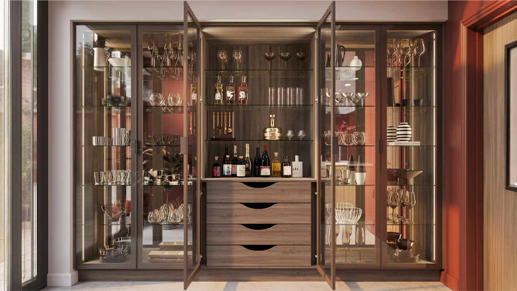 A luxury pantry with glass doors and Tuscan Walnut drawers