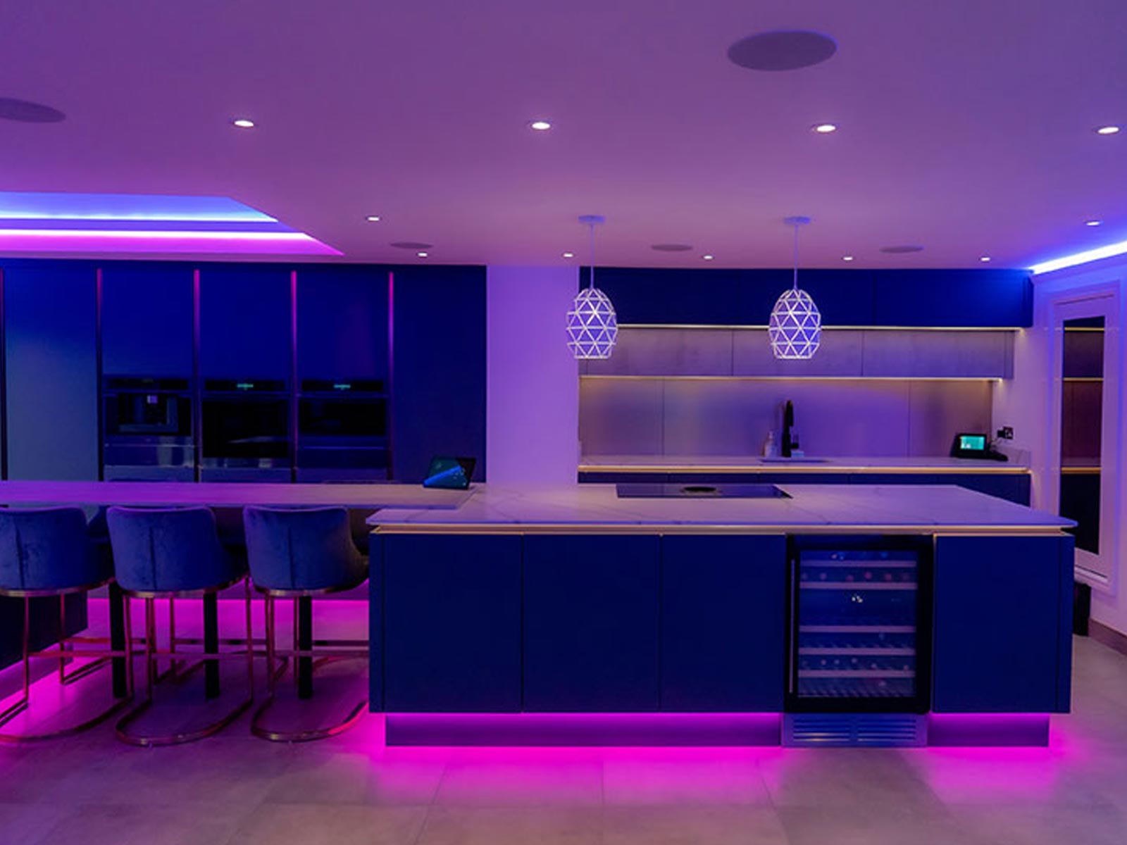 Home bar with kitchen island lighting and kitchen strip lights