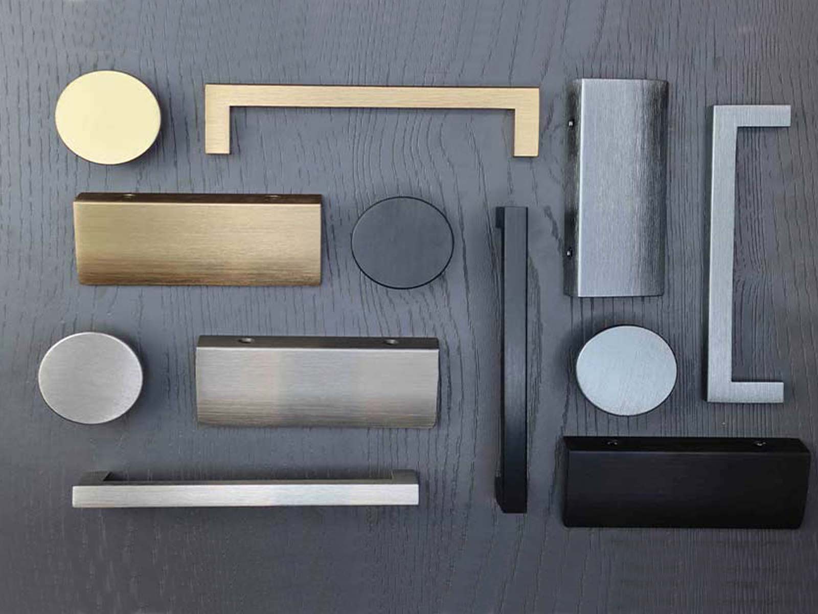 Modern kitchen cabinet handles in brushed metallic finishes