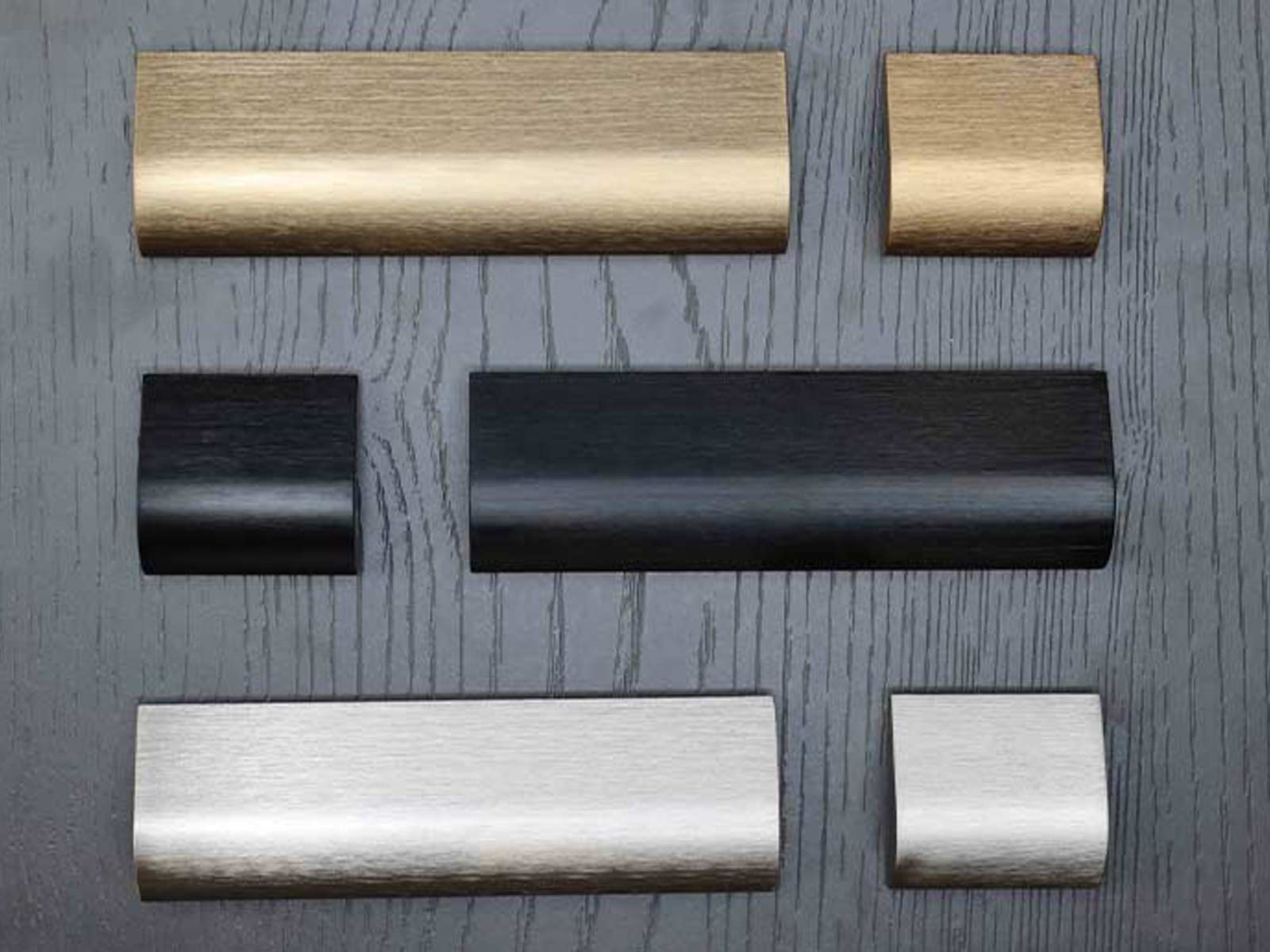 Modern kitchen cabinet handles in a brushed metallic finish