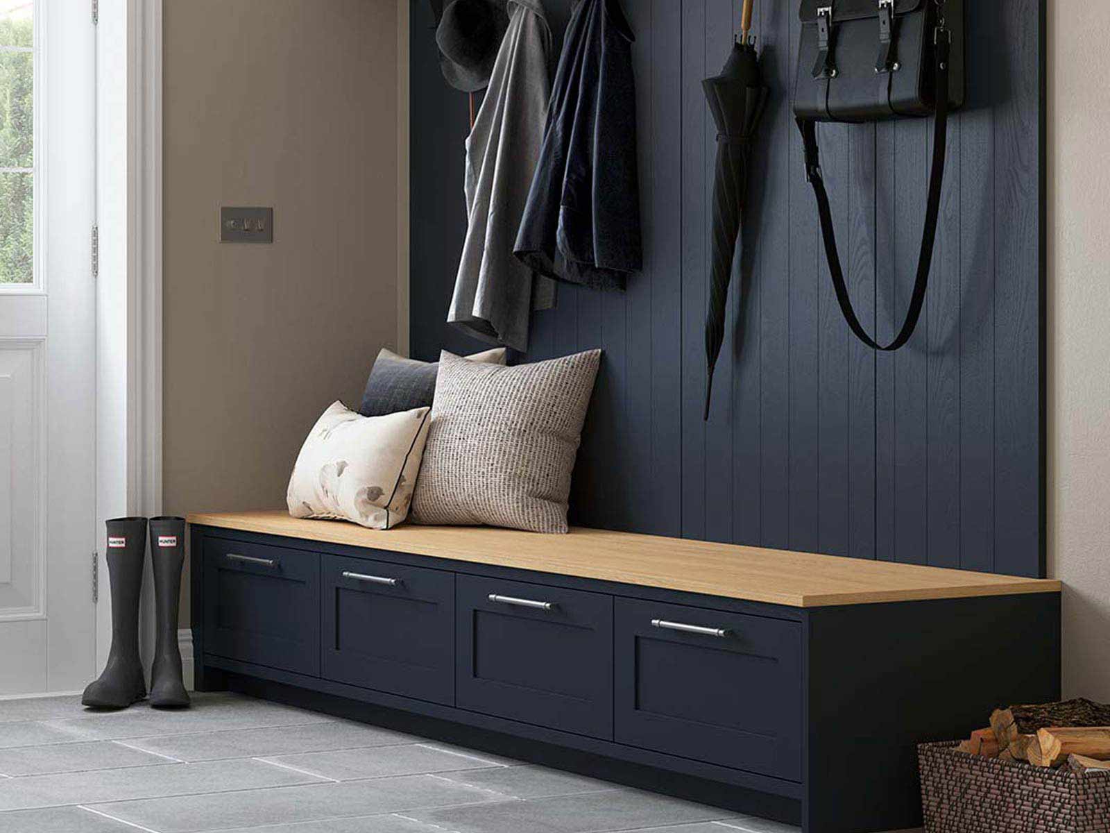 Utility room ideas featuring a bootility unit with dark blue doors