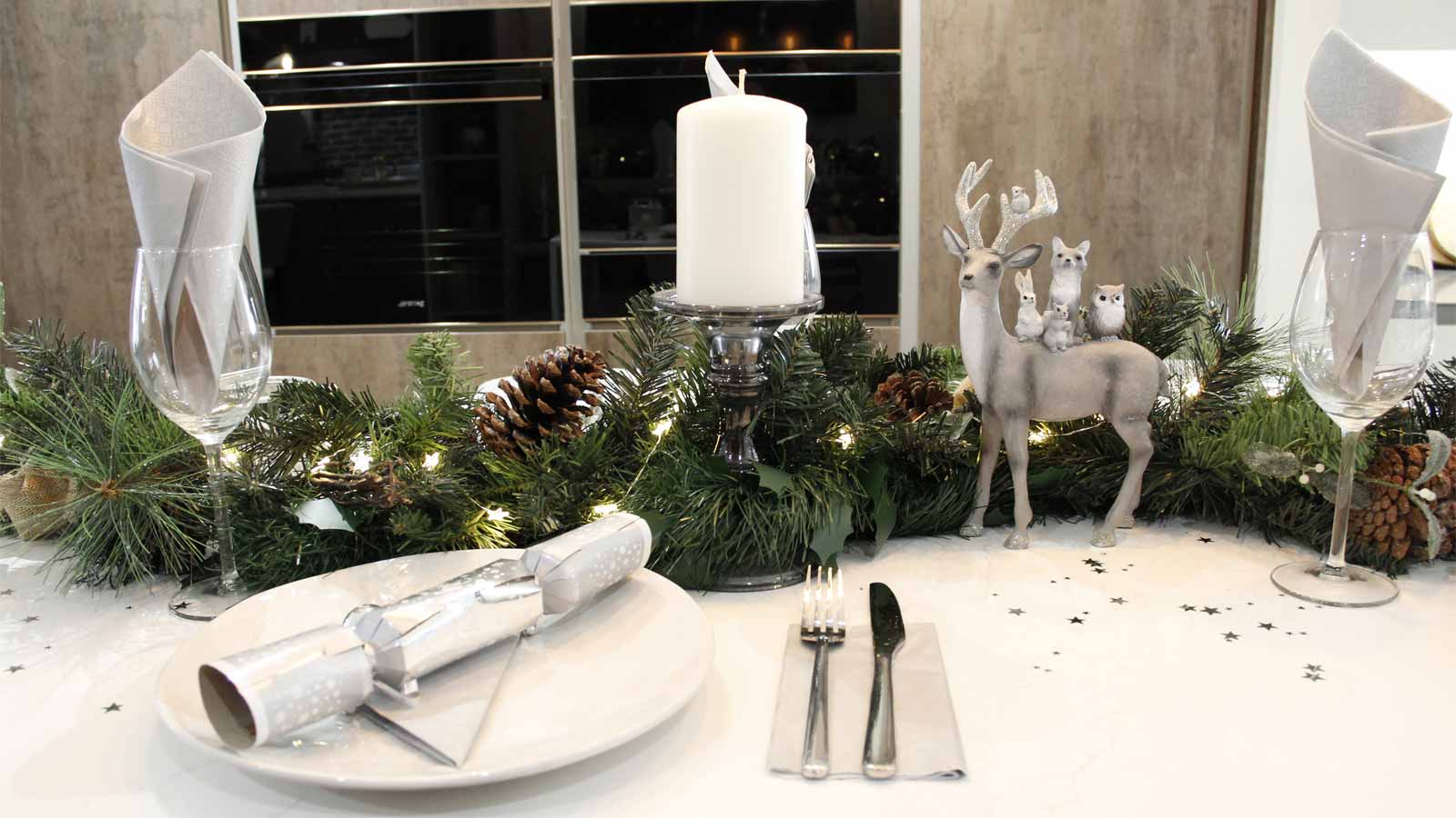 A decorated freestanding kitchen island with a white kitchen island worktop