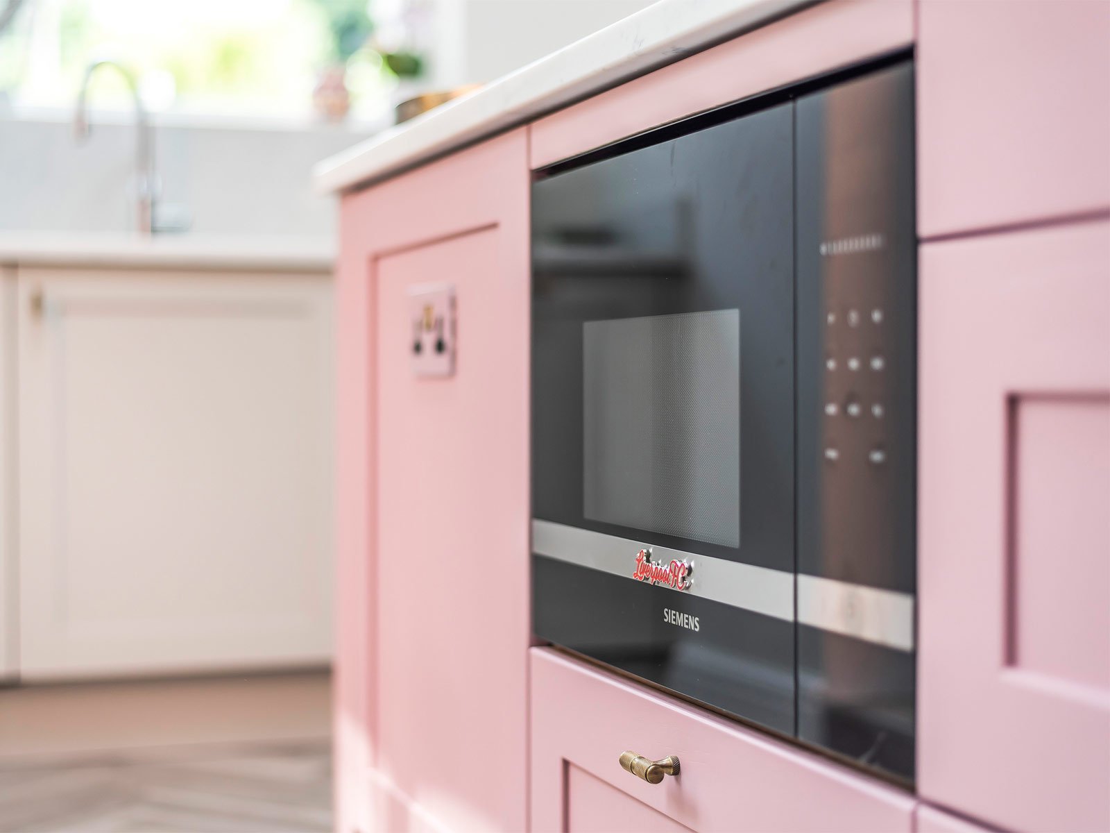 A retro pink kitchen with an eccentric kitchen vibe