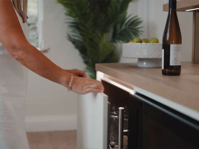 Kitchen units pull-out storage solutions in a white gloss kitchen