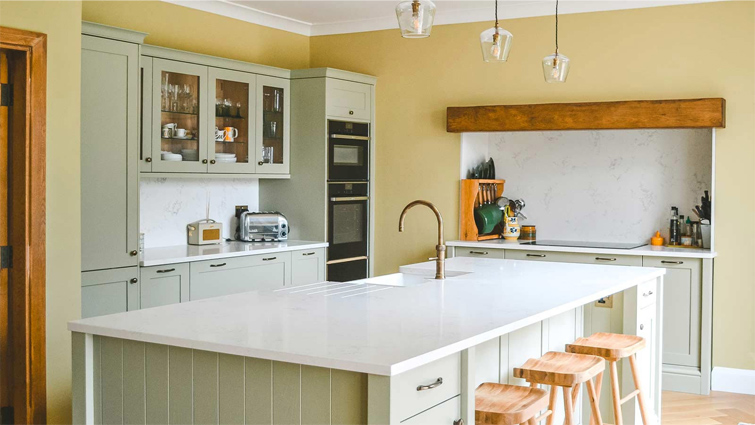 A green Shaker kitchen with earthy green kitchen cabinets