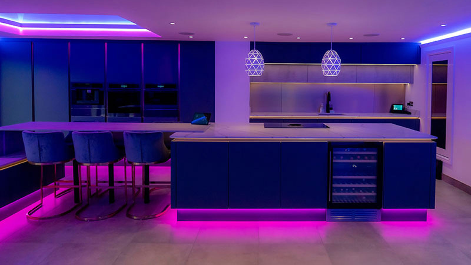 Home bar area with a wine fridge in a modern luxury kitchen