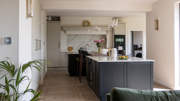 A kitchen island in a large kitchen which shows how much room for a kitchen island is ideal