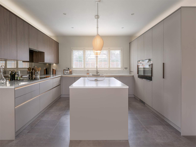 A sleek kitchen design with minimalist grey kitchen units